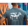 Guy wearing a navy Bateau restaurant t-shirt with 1st place beef cow design on the back